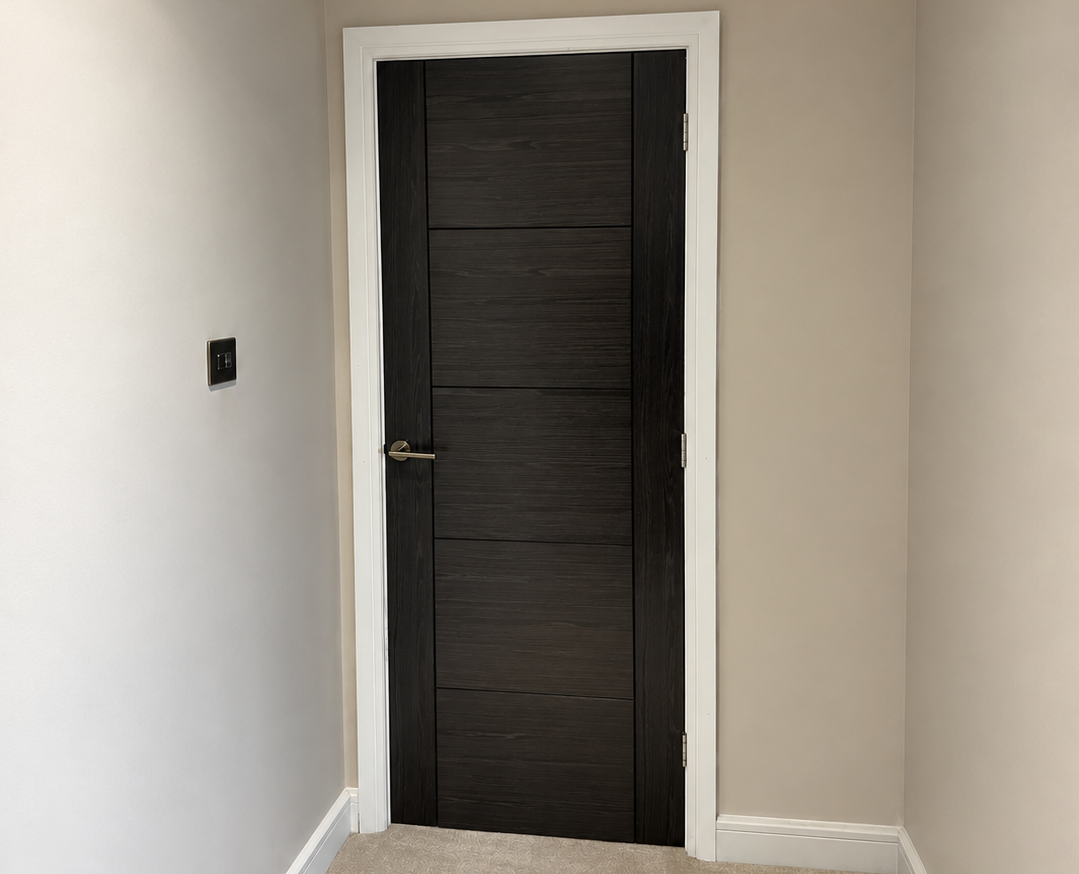 Charcoal grooved internal door with white frame fitted in Leicester