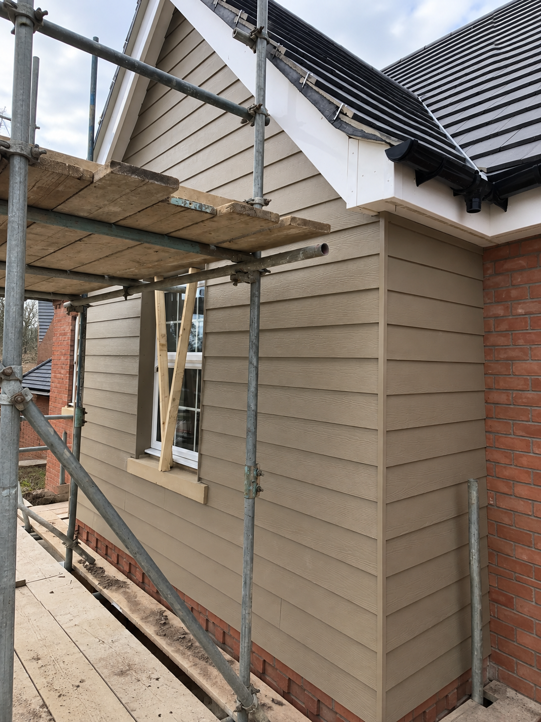 External timber cladding with new fascias and guttering fitted in Leicester
