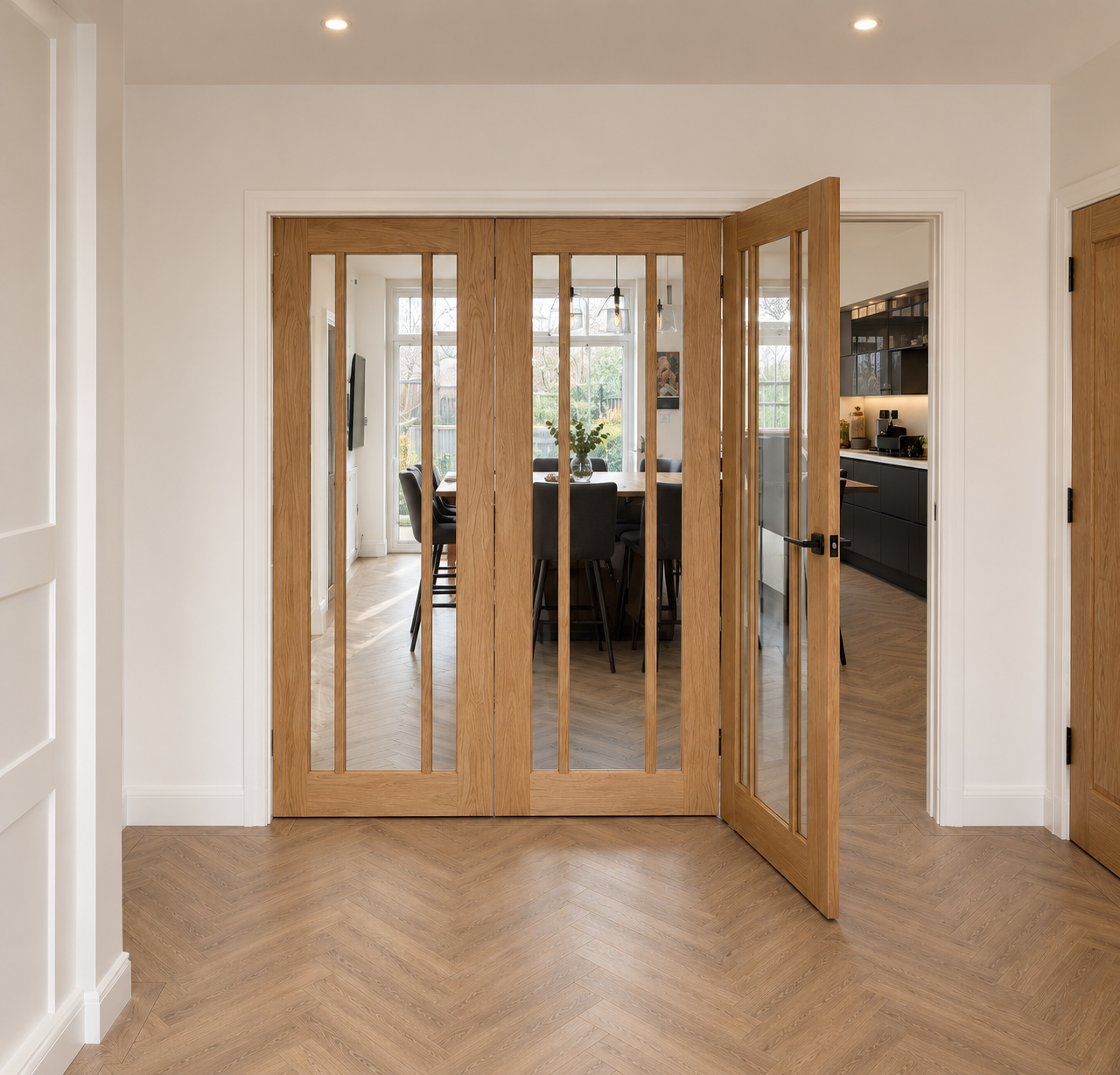 Glazed oak internal bi-fold doors between kitchen and dining room