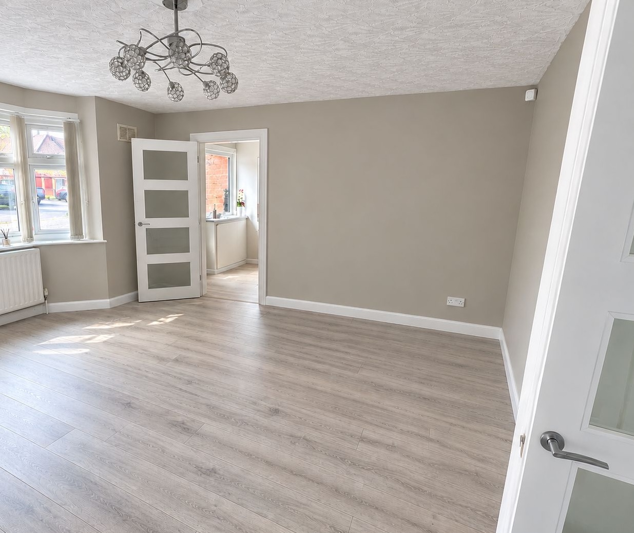 New laminate flooring fitted in a living room in Leicester