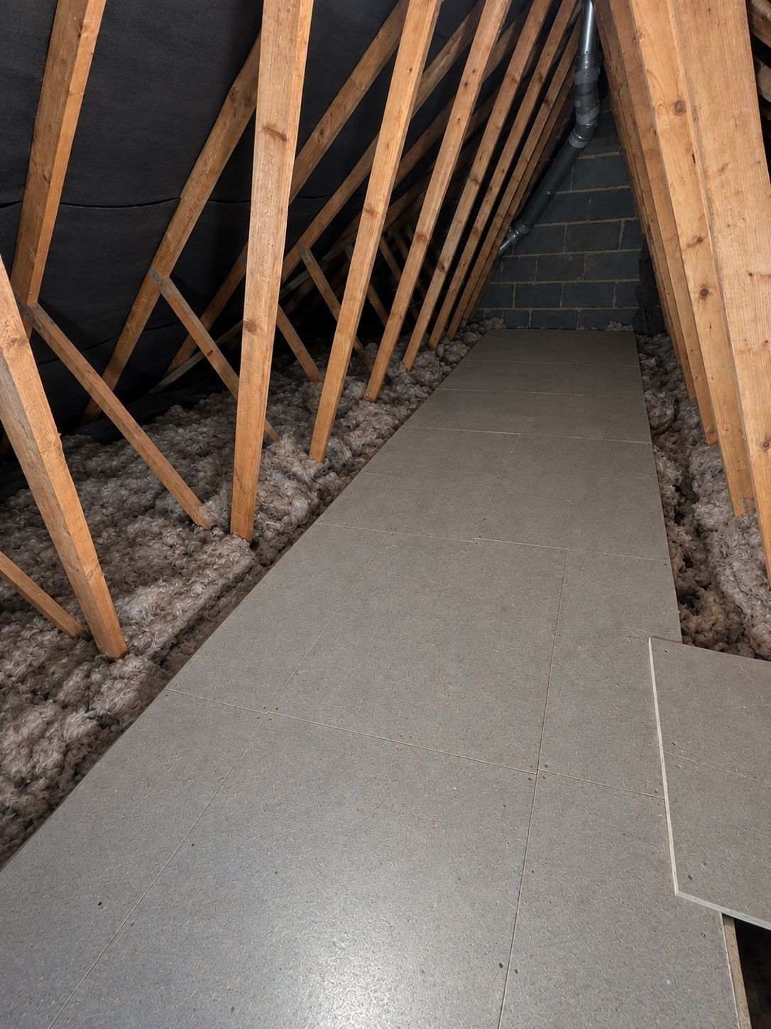 Boarded loft with raised walkway over insulation in Leicester