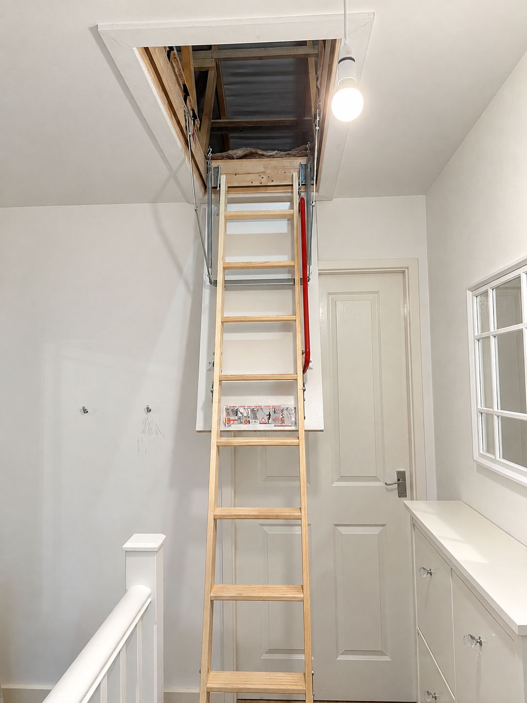 Timber folding loft ladder and insulated hatch fitted in Leicester