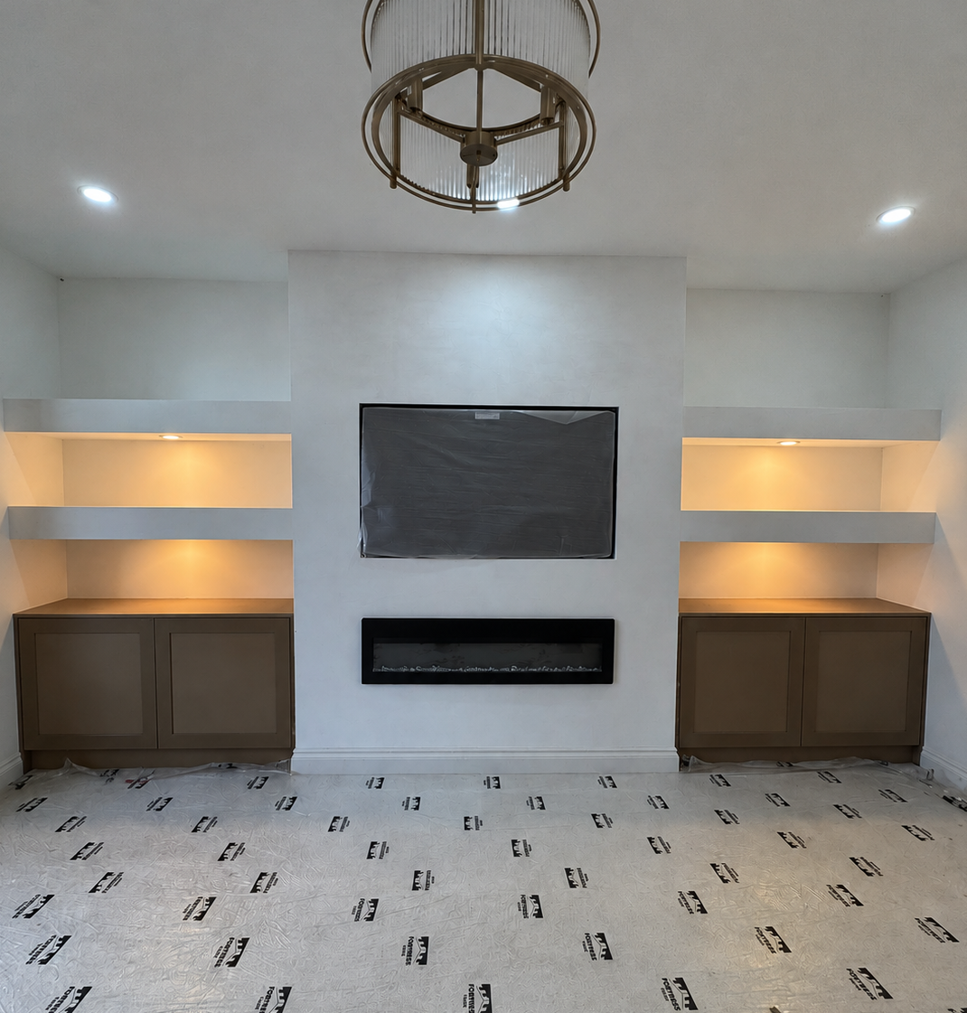 Media wall with floating shelves, cabinets and linear fireplace in Leicester